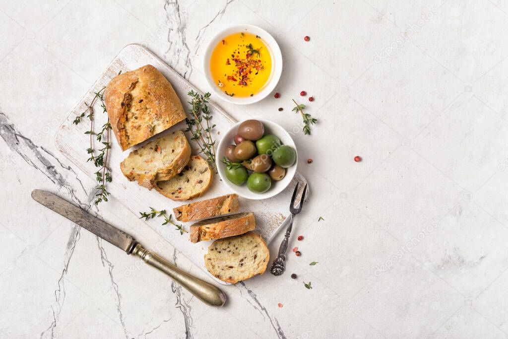Healthy bread with spicy olive oil and vintage cutlery