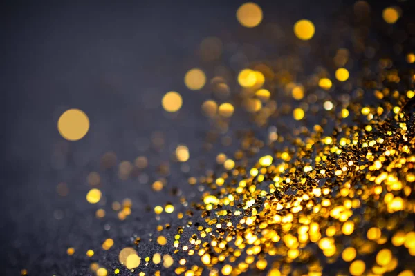 Abstrato dourado com fundo preto com efeito bokeh — Fotografia de Stock