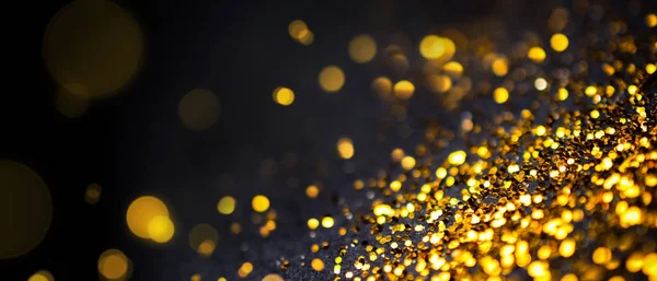 Abstrato dourado com fundo preto com efeito bokeh — Fotografia de Stock