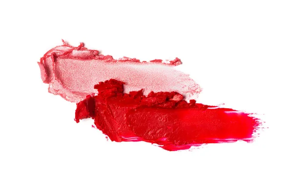 Abstriche von glänzendem Rosa und mattem roten Lippenstift — Stockfoto