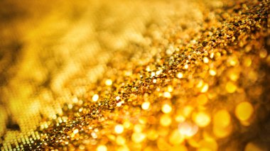 Parlak soyut bokeh arkaplanda odaklanmış altın parıltısı