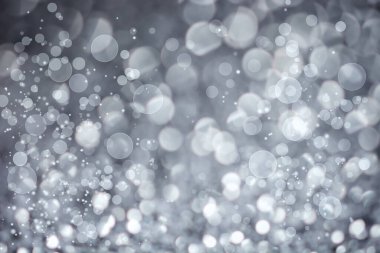 Soyut bokeh arkaplan üzerinde odaklanmış kar veya beyaz daireler