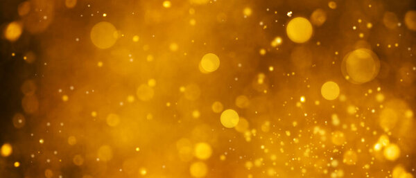 Banner of defocused golden circles on magic abstract bokeh background