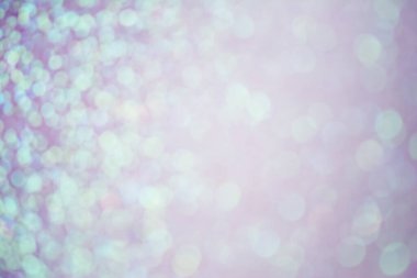 Soyut bokeh arkaplan üzerinde odaklanmış renkli simler ve parıltılar