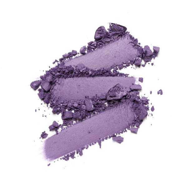 Flat lay of brush stroke. Broken bright eyeshadow as sample of cosmetic product isolated on white background
