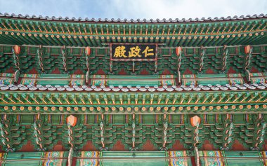 Details of colorful roof of the Changdeokgung Palace main hall i