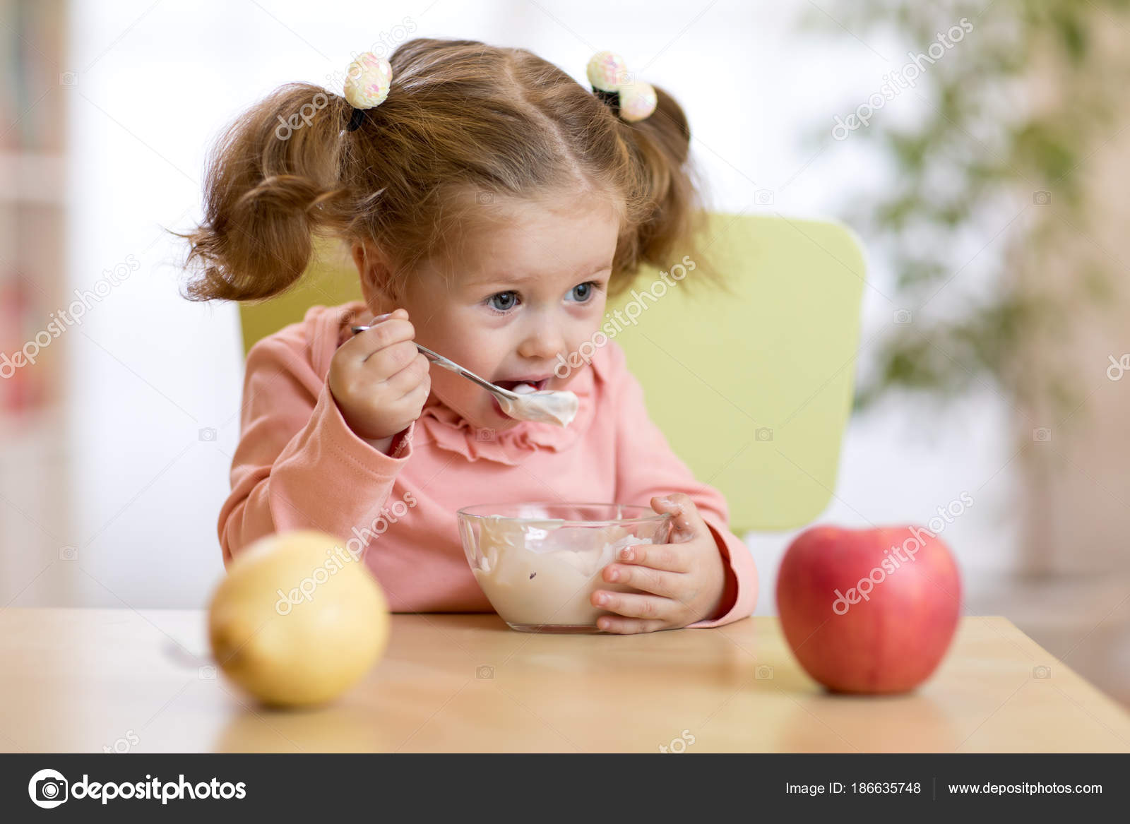 Child eating yogurt. — Stock Photo © oksun70 186635748