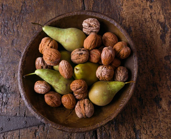 Antique bowl with pears and walnuts — Stock Photo, Image