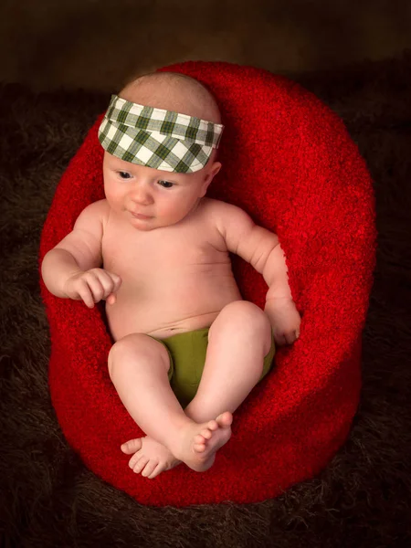 Newborn baby in armchair — Stock Photo, Image