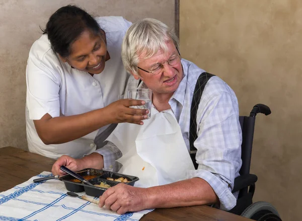 Elderly man refusing to drink water — Stock Photo, Image