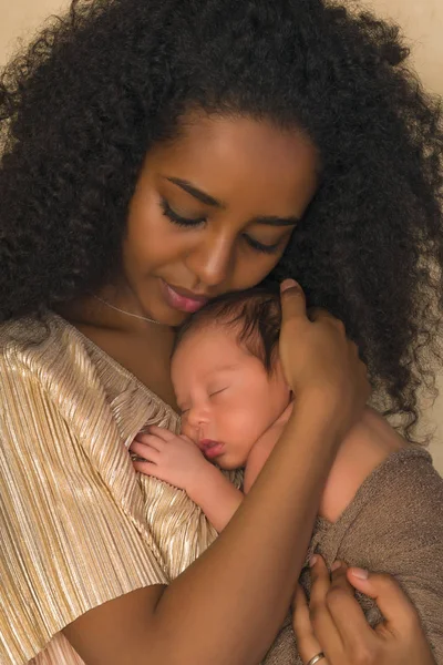 Mother love in gold dress — Stock Photo, Image