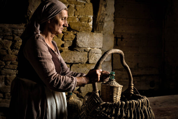 Renaissance maid checking food basket