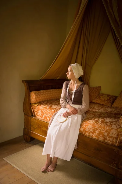 Vermeer style girl on canopy bed