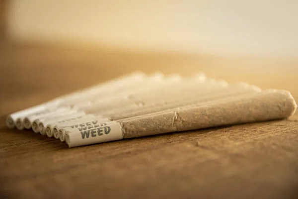 Bunch Marijuana Weed Joints Next Each Other Lined Rough Wood — Stock Photo, Image