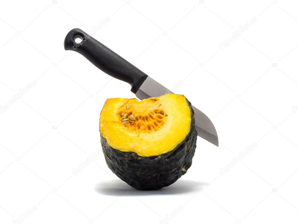 a knife stab equal part pumpkin on white background