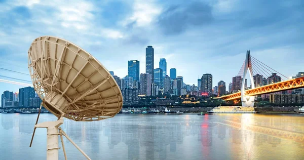 City night and box satellite dish — Stock Photo, Image