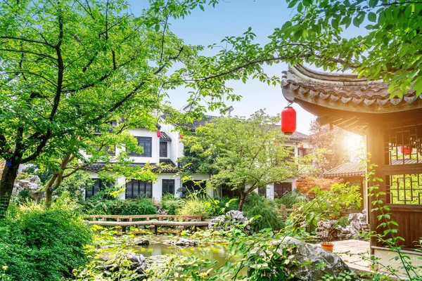 Wuxi, China, a garden of ancient architecture, the text on the pavilion is the introduction of the garden name and garden