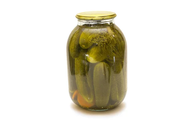 Pickled cucumbers isolated. Pickles in glass jar with garlic and — Stock Photo, Image