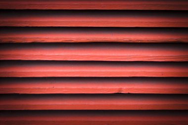 Eski ahşap bir duvar boyadı. kırmızı arkaplan