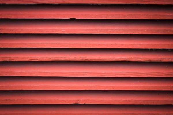 Pintado parede de madeira velha. fundo vermelho — Fotografia de Stock