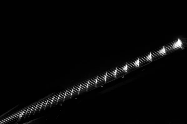 The tuning end of a guitar isolated on a black background. — Stock Photo, Image