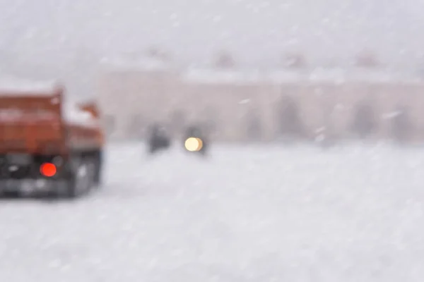 Blurred background - city during snowfall — Stock Image Blurred background - city during snowfall Stock Photo