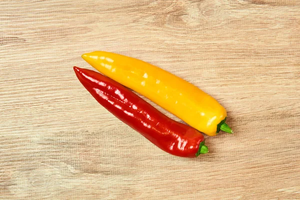 Two Pods Sweet Pepper Yellow Red Lie Table — Stock Photo, Image