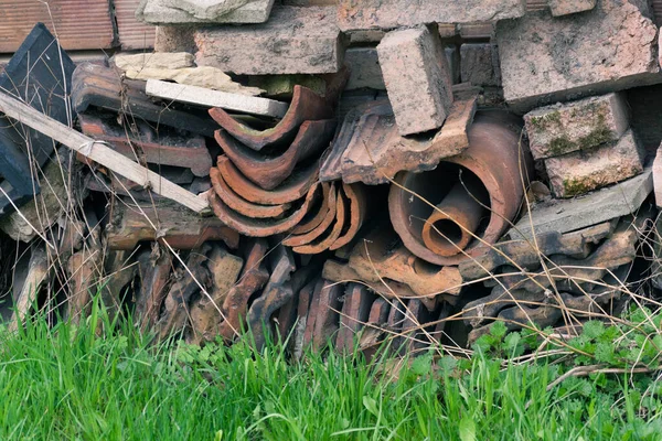 rubbish piled up against the wall