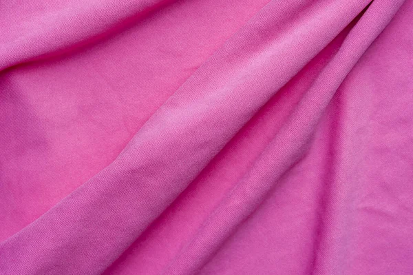 Closeup fragment af sammenkrøllet pink polyester stof - Stock-foto