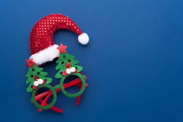 Funny Headband with Santa Claus Hat and Glasses With Green Christmas Trees.