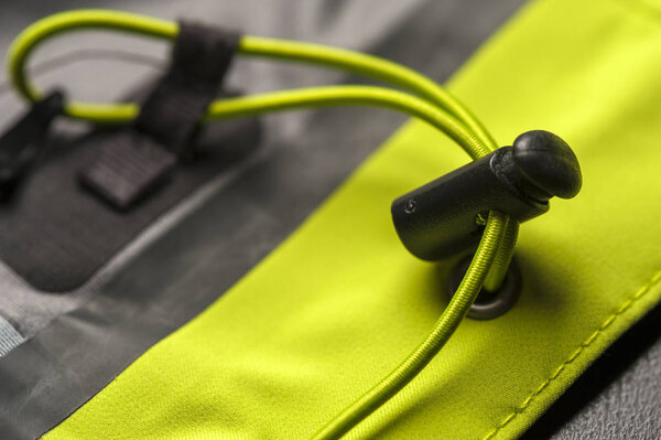 Close-up fragment of a green gray jacket