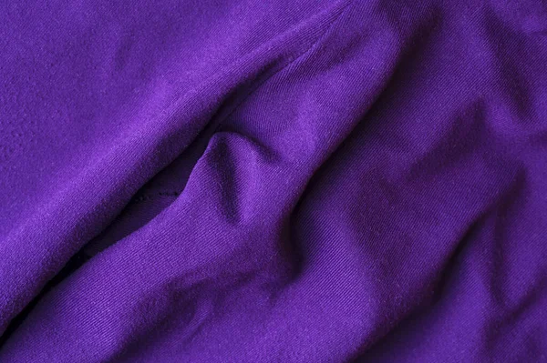 Fragment of crumpled violet polyester wear — ストック写真