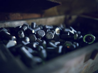 Close up of steel nuts and bolts in tool box