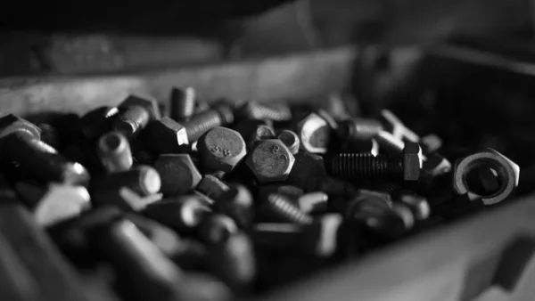 Close up of steel nuts and bolts in tool box — Stok fotoğraf