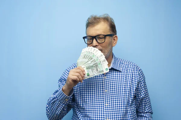 Confident elderly businessman with glasses