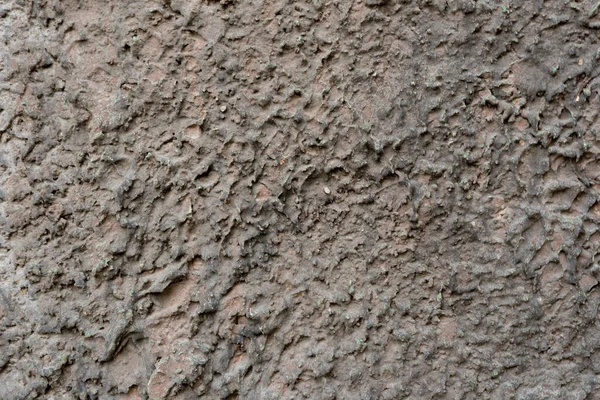 Крупный план - серо-коричневая каменная стена в старом фасаде дома — стоковое фото