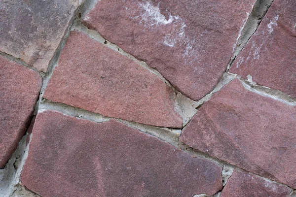 クローズアップ-家の古いファサードの茶色の石の壁 — ストック写真