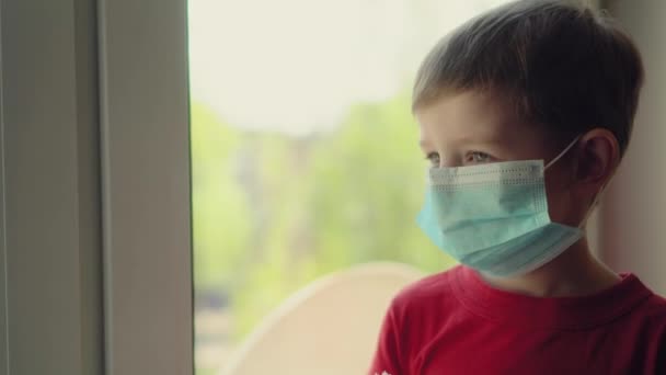 Cute blond boy in quarantine at home. baby is struggling with illness, fever and strong cough. Epidemic control of coronavirus and proper infection prevention. Child coughs — Stock Video