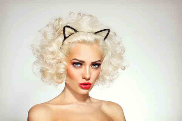Sexy blonde with cat ears headband — Stockfoto