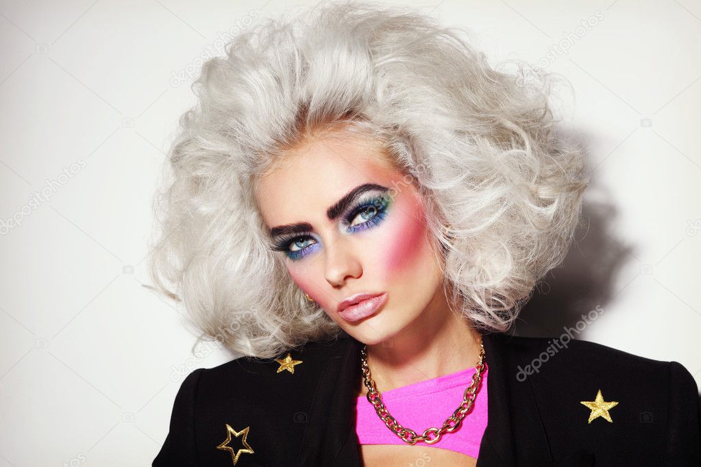 Young platinum blond woman with 80s makeup