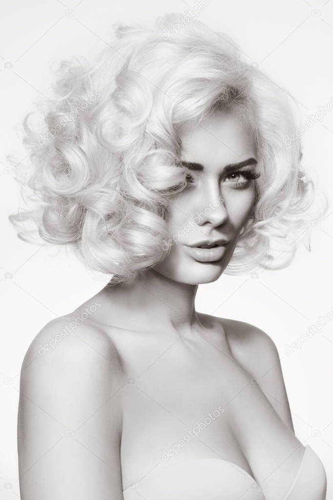 woman with platinum blonde curly hair