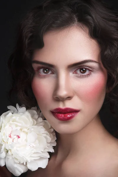 Young woman with white peony — Stock Photo, Image