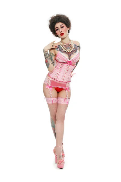 Gothic woman in pink corset and stockings — Stock Photo, Image