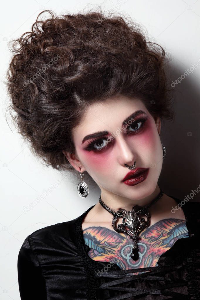 woman with vintage hairdo and gothic makeup