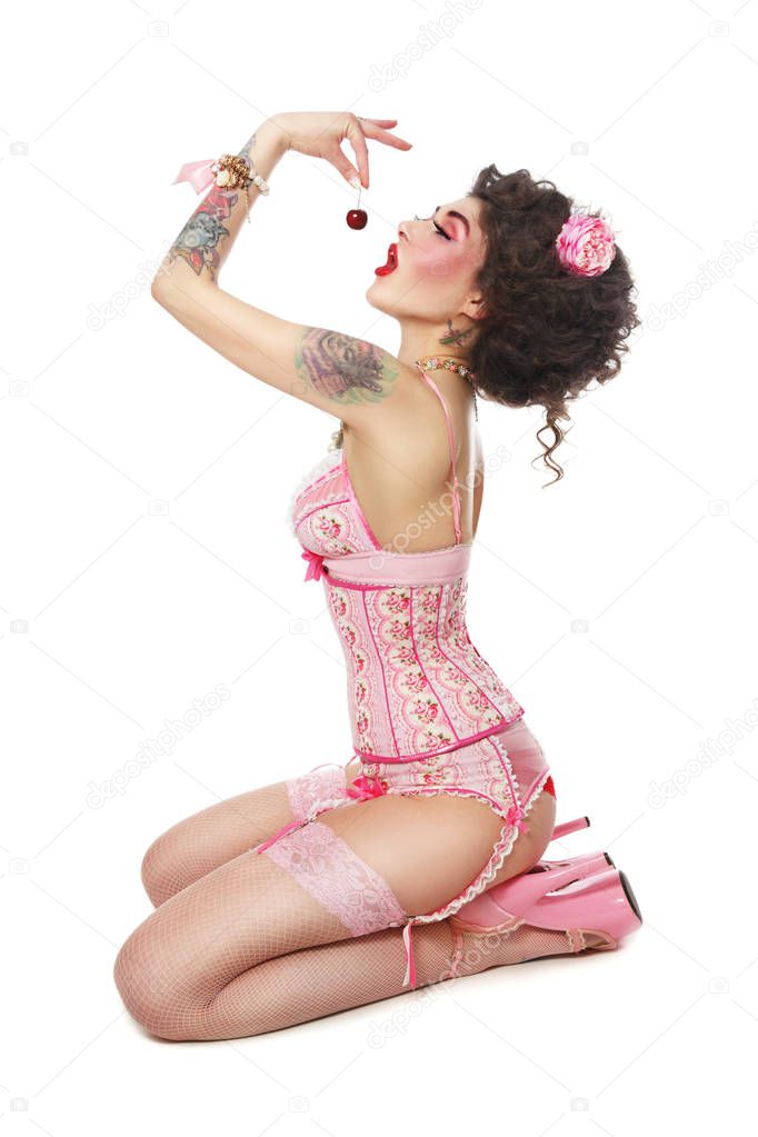 gothic woman in pink corset and stockings 