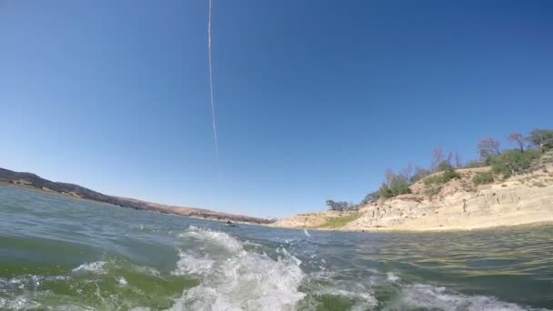Wakeboarder rising on water — Stock Video