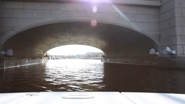 Crusing under a bridge in a boat — Αρχείο Βίντεο