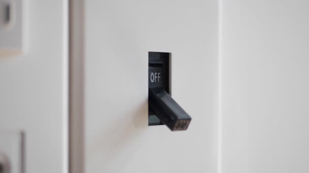 Light is Off. Male hand turn off electric breaker switch. 4k — Stock Video