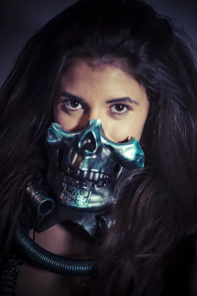 Girl posing with metallic skull mask — Stock Photo, Image