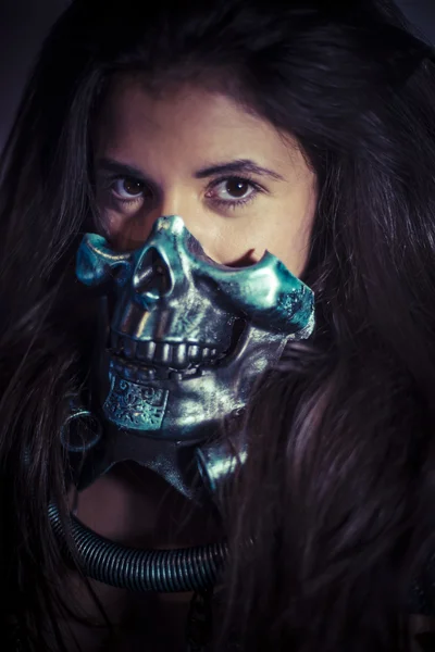 Girl posing with metallic skull mask — Stock Photo, Image